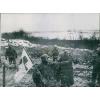 Bearing   a red cross flag on shovel, two German soldiers surrender near Metz and #1 small image